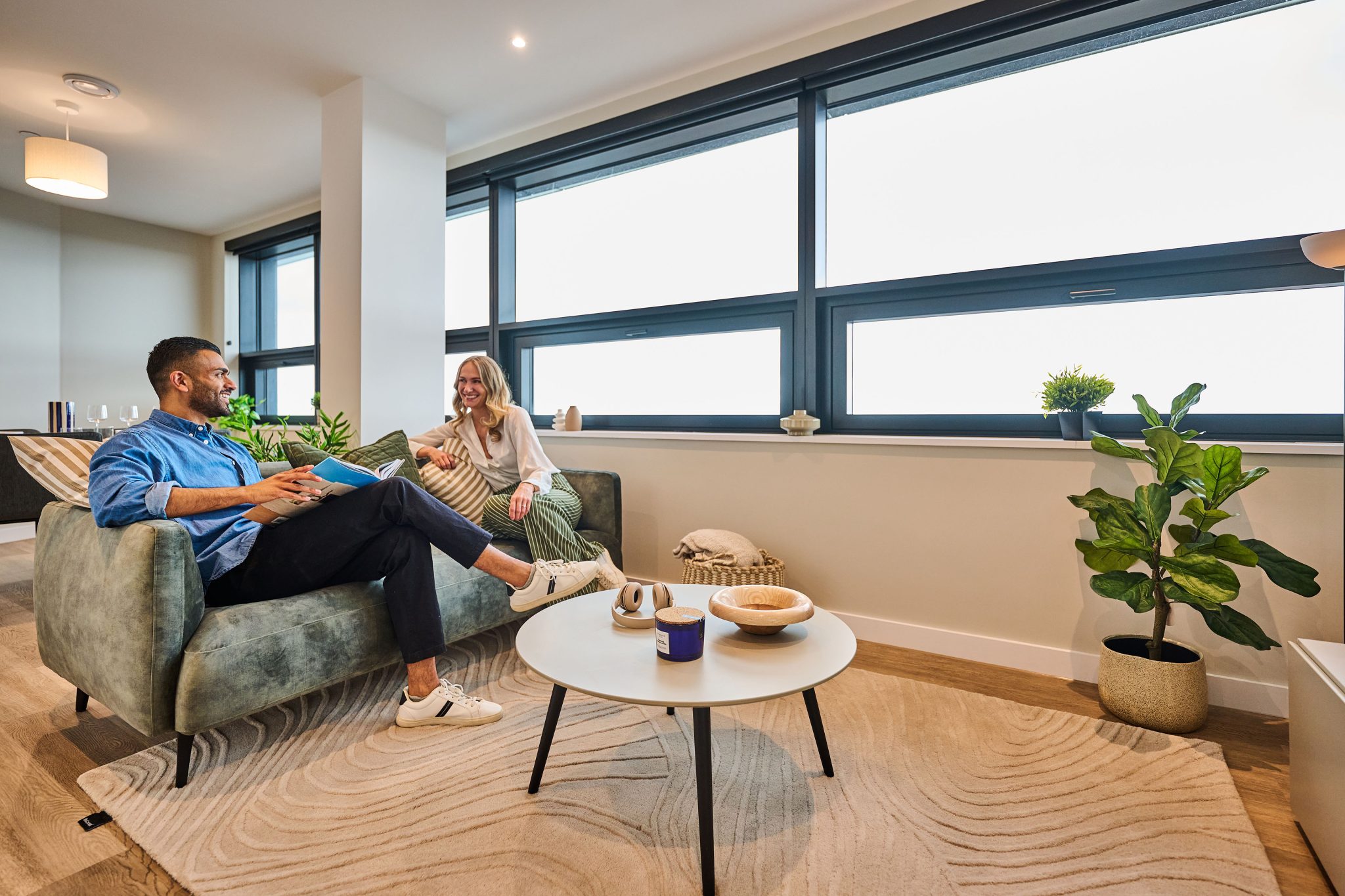 Couple relaxing in the lounge of The Octagon luxury residential apartment