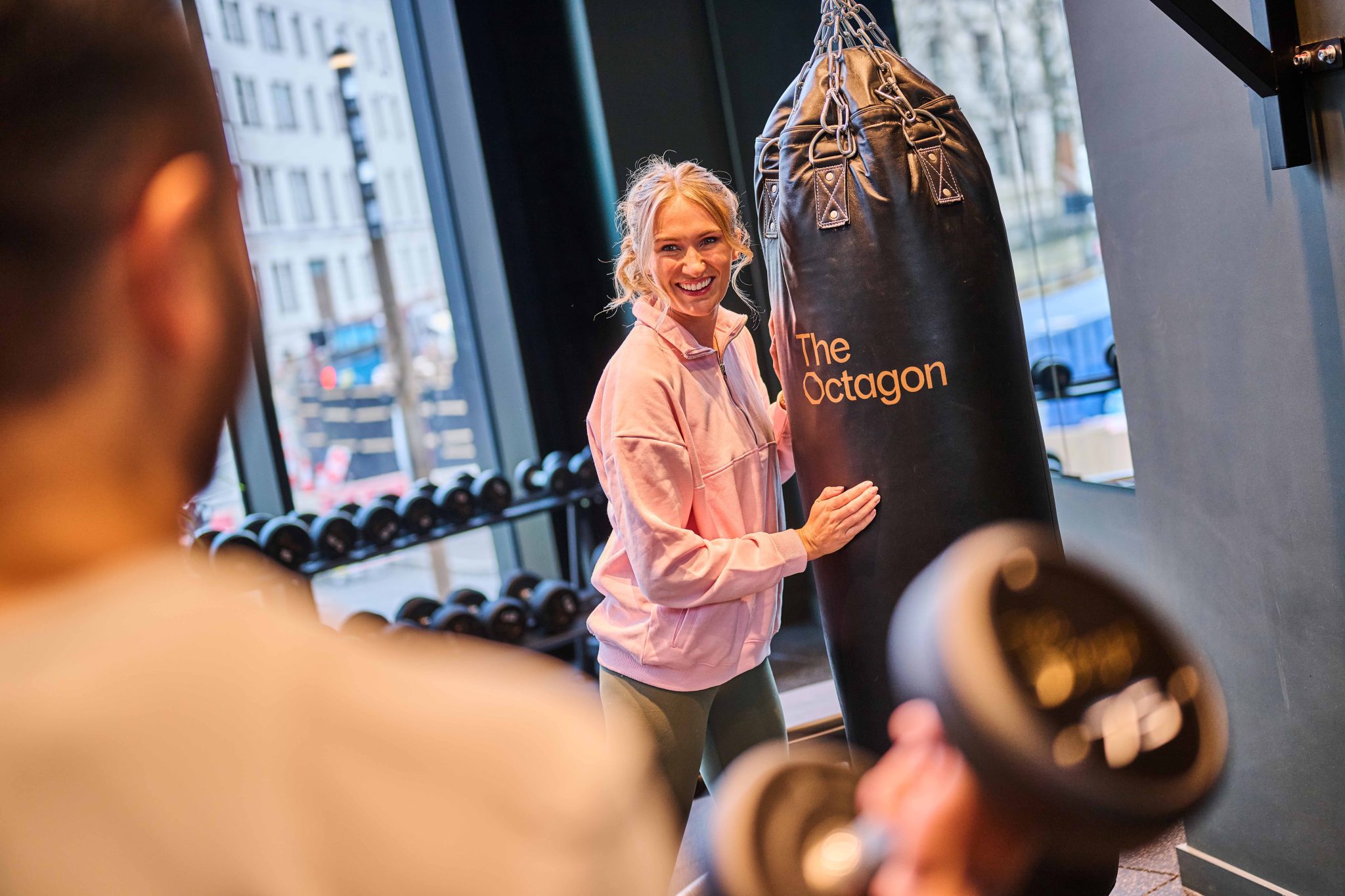 Residents enjoying fitness facilities in The Octagon luxury apartments for rent