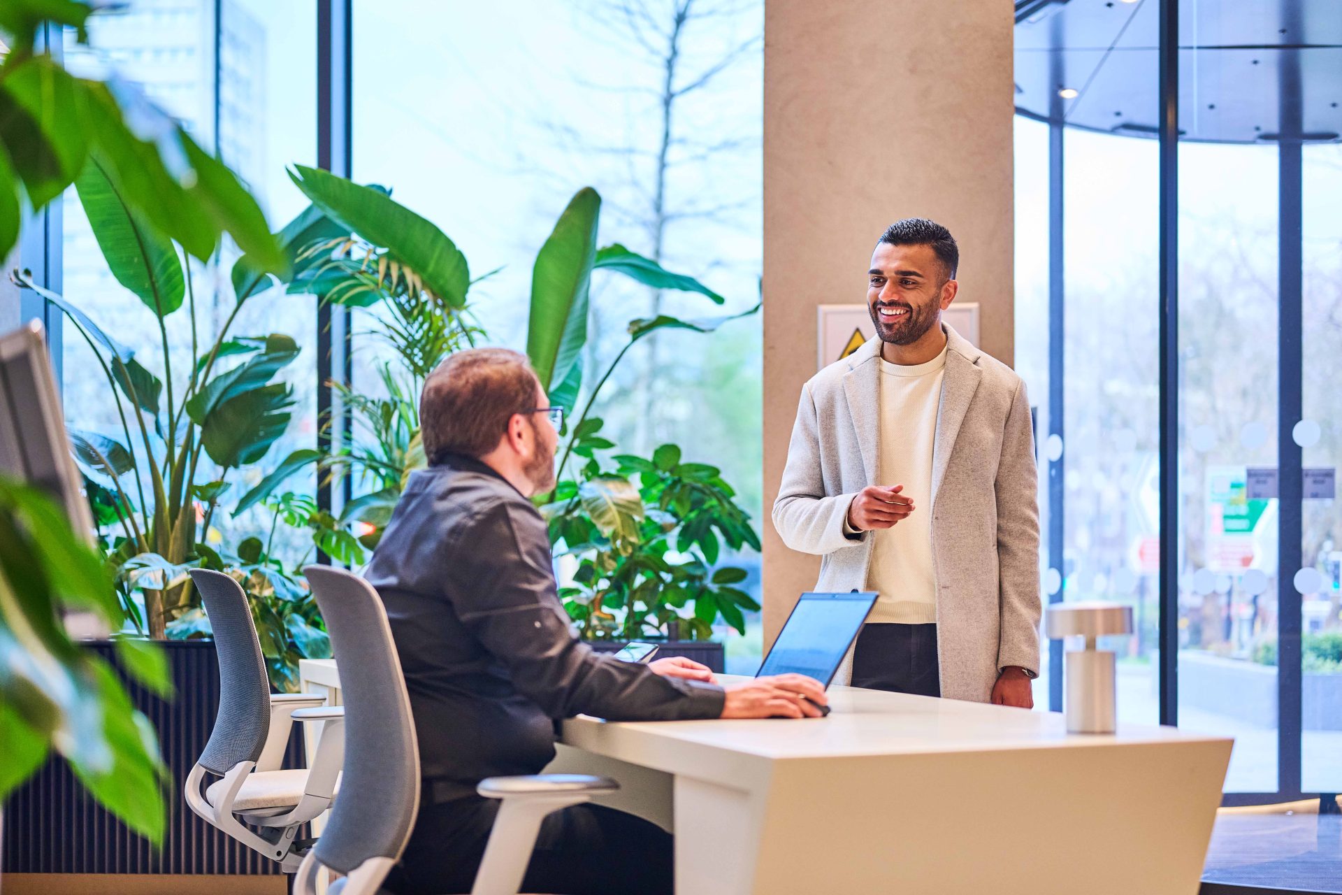 Tenant being greeted my a member of The Octagon concierge team at the front desk